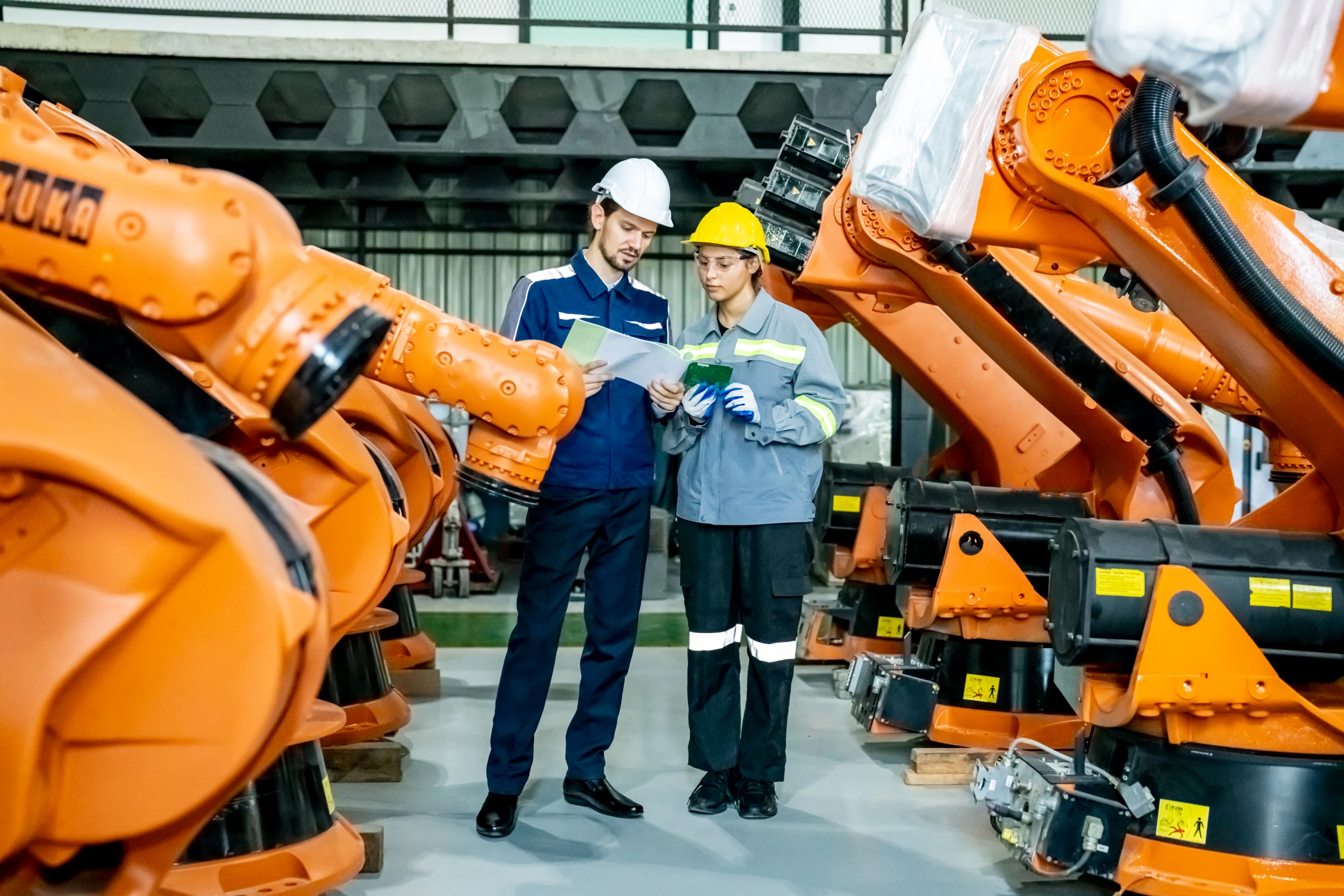 engineer-inspecting-automatic-ai-robot-arm-and-mac-2025-02-03-09-33-58-utc-scaled